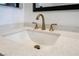 Close up of the stylish vanity featuring a white countertop and bronze-colored fixtures at 3157 Faiss Dr, Las Vegas, NV 89134