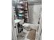 Neat bathroom features a shower, toilet, sink, and storage shelves at 324 Princeton St, Las Vegas, NV 89107