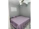 Simple bedroom with marble floors and a ceiling fan at 324 Princeton St, Las Vegas, NV 89107