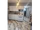 Bright kitchen with white cabinets, modern appliances, and marble flooring at 324 Princeton St, Las Vegas, NV 89107