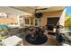 Backyard features an outdoor kitchen, a bar, and seating beneath the covered patio at 3355 Royal Bay Dr, Las Vegas, NV 89117