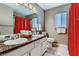 Bathroom featuring a double sink vanity, decorative countertops, and a bright red shower curtain at 3355 Royal Bay Dr, Las Vegas, NV 89117