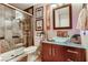 Stylish bathroom with a unique glass bowl sink, modern vanity, and tiled walk-in shower at 3355 Royal Bay Dr, Las Vegas, NV 89117