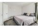 Cozy bedroom featuring neutral gray walls, plush carpeting, and comfortable bed with gray quilted blanket at 3355 Royal Bay Dr, Las Vegas, NV 89117