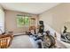 Bright bedroom with natural light, neutral walls, and an exercise machine, perfect for a home gym at 3355 Royal Bay Dr, Las Vegas, NV 89117