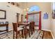 Cozy dining room with natural light and dark wood table at 3355 Royal Bay Dr, Las Vegas, NV 89117