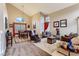 Spacious living room with vaulted ceilings, large windows, and comfortable seating area at 3355 Royal Bay Dr, Las Vegas, NV 89117