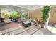 Covered patio includes outdoor furniture, fire pit, and well-maintained landscaping at 3355 Royal Bay Dr, Las Vegas, NV 89117
