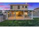 Grassy backyard featuring a covered patio perfect for outdoor seating and entertaining at 353 Templeton Dr, Henderson, NV 89074