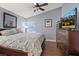 Comfortable bedroom with wood floors, a fan and nice natural lighting at 353 Templeton Dr, Henderson, NV 89074