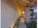 Inviting front entryway with decorative door, desert landscaping, and stone pillars at 353 Templeton Dr, Henderson, NV 89074