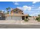 Inviting two-story home with a spacious three-car garage and well-manicured landscaping at 353 Templeton Dr, Henderson, NV 89074