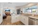 Open-concept kitchen with granite counters, stainless steel appliances, and connection to the living area at 353 Templeton Dr, Henderson, NV 89074