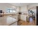 Well-lit kitchen with granite countertops, white cabinets and stainless steel appliances at 353 Templeton Dr, Henderson, NV 89074