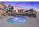 Backyard pool area with lounge chairs, mature landscaping, and a serene atmosphere at 353 Templeton Dr, Henderson, NV 89074