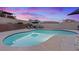 Backyard kidney-shaped pool with seating at 353 Templeton Dr, Henderson, NV 89074