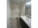 Bright bathroom featuring a combination tub and shower, modern vanity and ample lighting at 3585 Arville St # 403A, Las Vegas, NV 89103