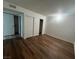 Bedroom featuring laminate floors, neutral walls, and a closet with sliding doors at 3585 Arville St # 403A, Las Vegas, NV 89103