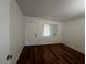 Bedroom with wood-look flooring and window at 3585 Arville St # 403A, Las Vegas, NV 89103