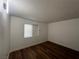 Bedroom featuring laminate floors, neutral walls, and a window at 3585 Arville St # 403A, Las Vegas, NV 89103