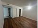Bedroom featuring laminate floors, neutral walls, and a closet with sliding doors at 3585 Arville St # 403A, Las Vegas, NV 89103
