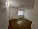 Bedroom with wood-look flooring and window at 3585 Arville St # 403A, Las Vegas, NV 89103