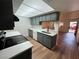 Renovated kitchen featuring wood floors and quartz countertops and updated appliances at 3585 Arville St # 403A, Las Vegas, NV 89103