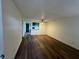 Spacious living room featuring wood floors, neutral walls and updated ceiling fan at 3585 Arville St # 403A, Las Vegas, NV 89103