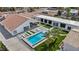 Aerial view of the pool and outdoor lounge area with desert landscaping and several lounge chairs at 3630 Tobias Ln, Las Vegas, NV 89120