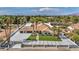 Gorgeous home with a long driveway, attached garage, well-maintained landscaping, and a tiled roof at 3630 Tobias Ln, Las Vegas, NV 89120