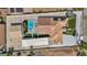 Aerial view of a stunning house with a pool, solar panels, luscious landscaping, and a multi-car garage at 3630 Tobias Ln, Las Vegas, NV 89120