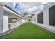 Lush backyard featuring a pristine lawn and a patio perfect for outdoor entertaining at 3630 Tobias Ln, Las Vegas, NV 89120