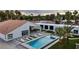 Aerial view of a modern backyard oasis with a pool, jacuzzi, lounge chairs, and desert landscaping at 3630 Tobias Ln, Las Vegas, NV 89120