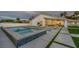 Backyard featuring a modern pool and jacuzzi, lounge chairs, and desert landscaping at 3630 Tobias Ln, Las Vegas, NV 89120