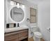 Modern bathroom features stylish vanity with unique mirror and contemporary fixtures at 3630 Tobias Ln, Las Vegas, NV 89120