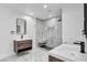 Modern bathroom featuring dual sinks, a spacious shower, and elegant finishes at 3630 Tobias Ln, Las Vegas, NV 89120