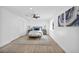 Bright bedroom with modern decor, ample closet space, and a cozy seating area at 3630 Tobias Ln, Las Vegas, NV 89120