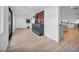 Inviting entryway with wood floors, stylish console table, and an open view into the kitchen at 3630 Tobias Ln, Las Vegas, NV 89120