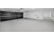 Spacious garage featuring a sleek, modern door and durable flooring at 3630 Tobias Ln, Las Vegas, NV 89120