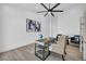 Stylish home office with a modern desk, comfortable seating, and light wood floors at 3630 Tobias Ln, Las Vegas, NV 89120