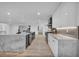 Modern kitchen featuring marble countertops, stainless steel appliances, and a center island at 3630 Tobias Ln, Las Vegas, NV 89120