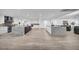 Spacious kitchen with double islands, modern appliances, sleek white cabinets, and contemporary design at 3630 Tobias Ln, Las Vegas, NV 89120