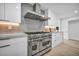Modern kitchen features stainless steel appliances, sleek white cabinets, and spacious countertops at 3630 Tobias Ln, Las Vegas, NV 89120