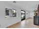 Bright living area featuring modern decor, wood floors, and views of the outdoor scenery at 3630 Tobias Ln, Las Vegas, NV 89120