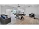 Bright living room with modern finishes and a pool table for entertaining at 3630 Tobias Ln, Las Vegas, NV 89120