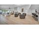 Open-concept living room with a modern fireplace, stylish furniture, and hardwood floors, perfect for gatherings at 3630 Tobias Ln, Las Vegas, NV 89120
