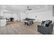 Open-concept living room featuring a pool table and stylish seating area at 3630 Tobias Ln, Las Vegas, NV 89120