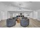 Open floor plan with modern lighting, stylish furniture, and sleek design flows into the kitchen at 3630 Tobias Ln, Las Vegas, NV 89120