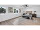 Light-filled main bedroom features hardwood floors, bedside tables, and stylish artwork at 3630 Tobias Ln, Las Vegas, NV 89120