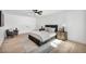 Comfortable main bedroom with neutral decor, hardwood floors and ceiling fan at 3630 Tobias Ln, Las Vegas, NV 89120